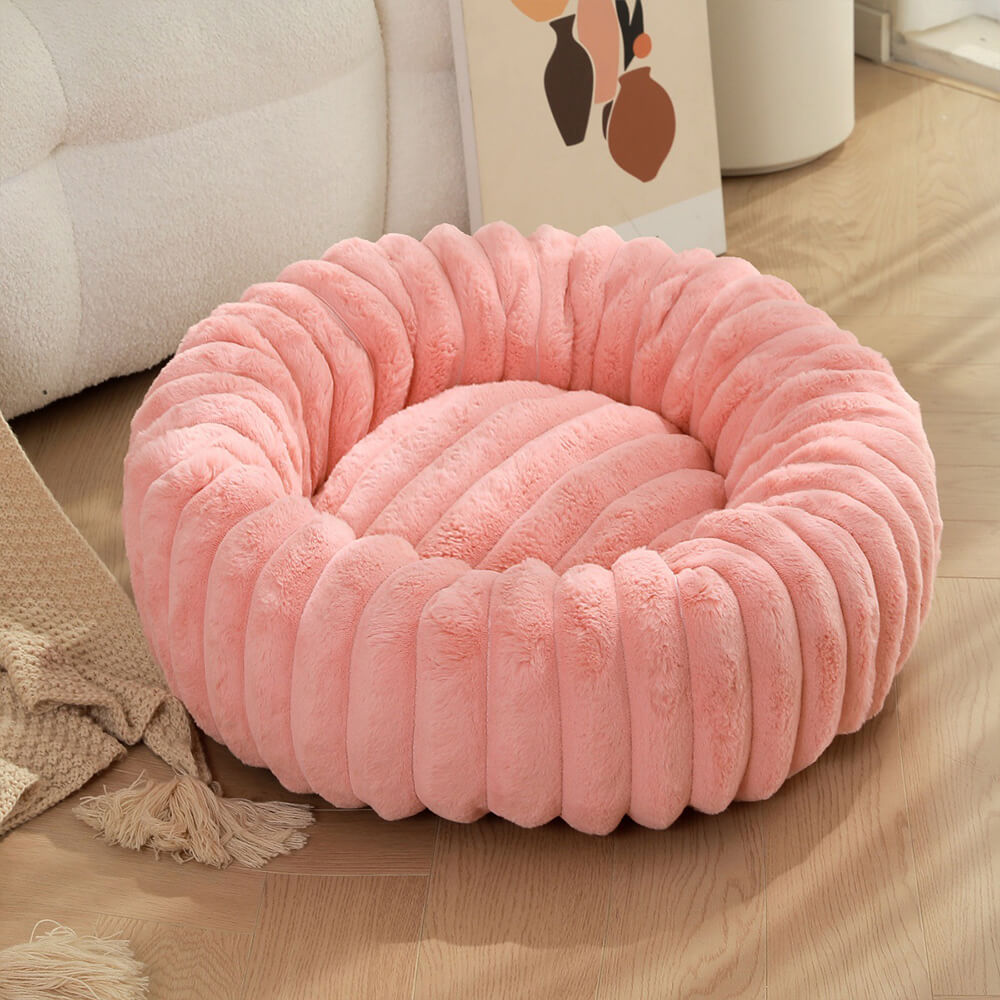 Letto per cani e gatti a forma di ciambella ultra-morbido in peluche.