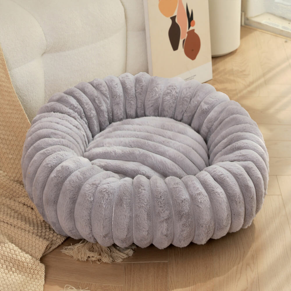 Letto per cani e gatti a forma di ciambella ultra-morbido in peluche.