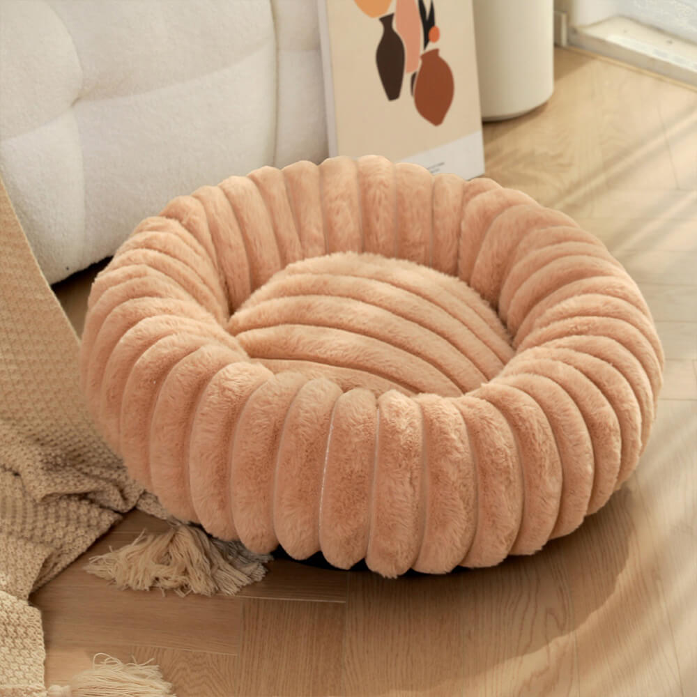 Letto per cani e gatti a forma di ciambella ultra-morbido in peluche.