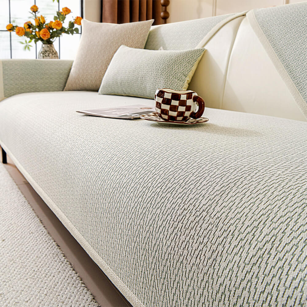 Copertura per divano in tessuto chenille minimalista antiscivolo con design resistente ai graffi dei gatti.
