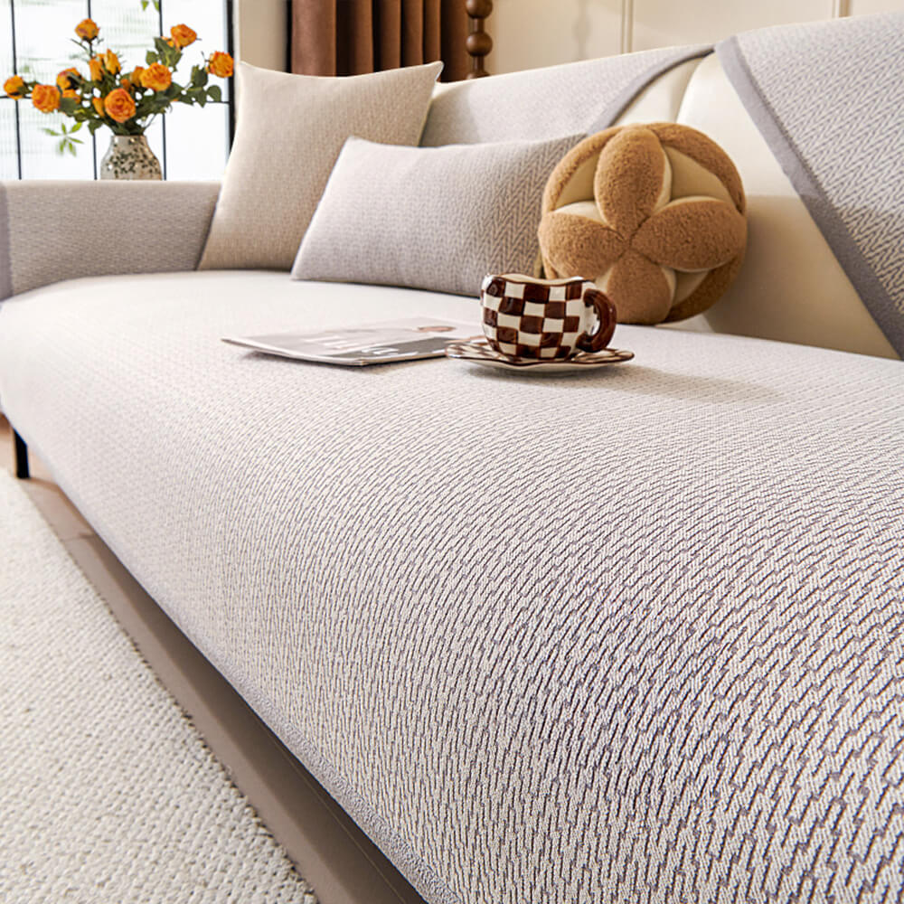 Copertura per divano in tessuto chenille minimalista antiscivolo con design resistente ai graffi dei gatti.