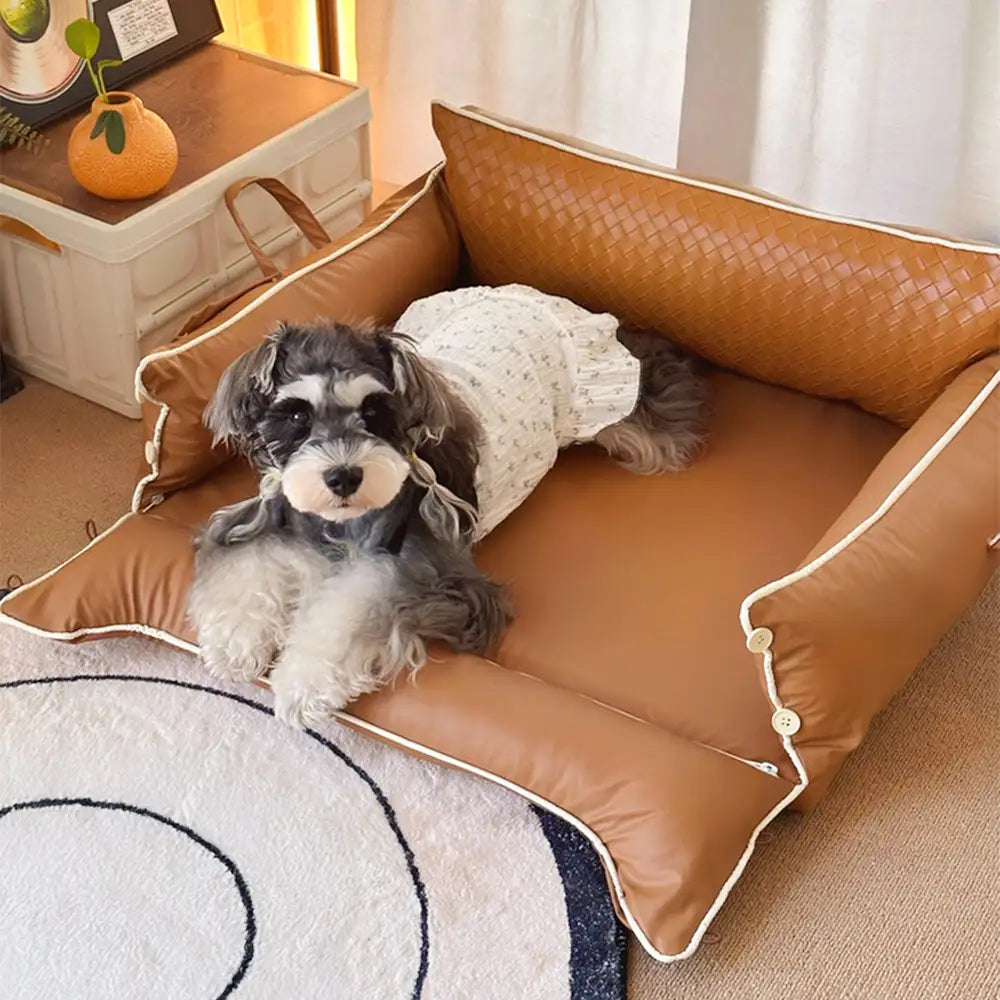Letto per cani in pelle sintetica impermeabile con schienale protettivo in lattice