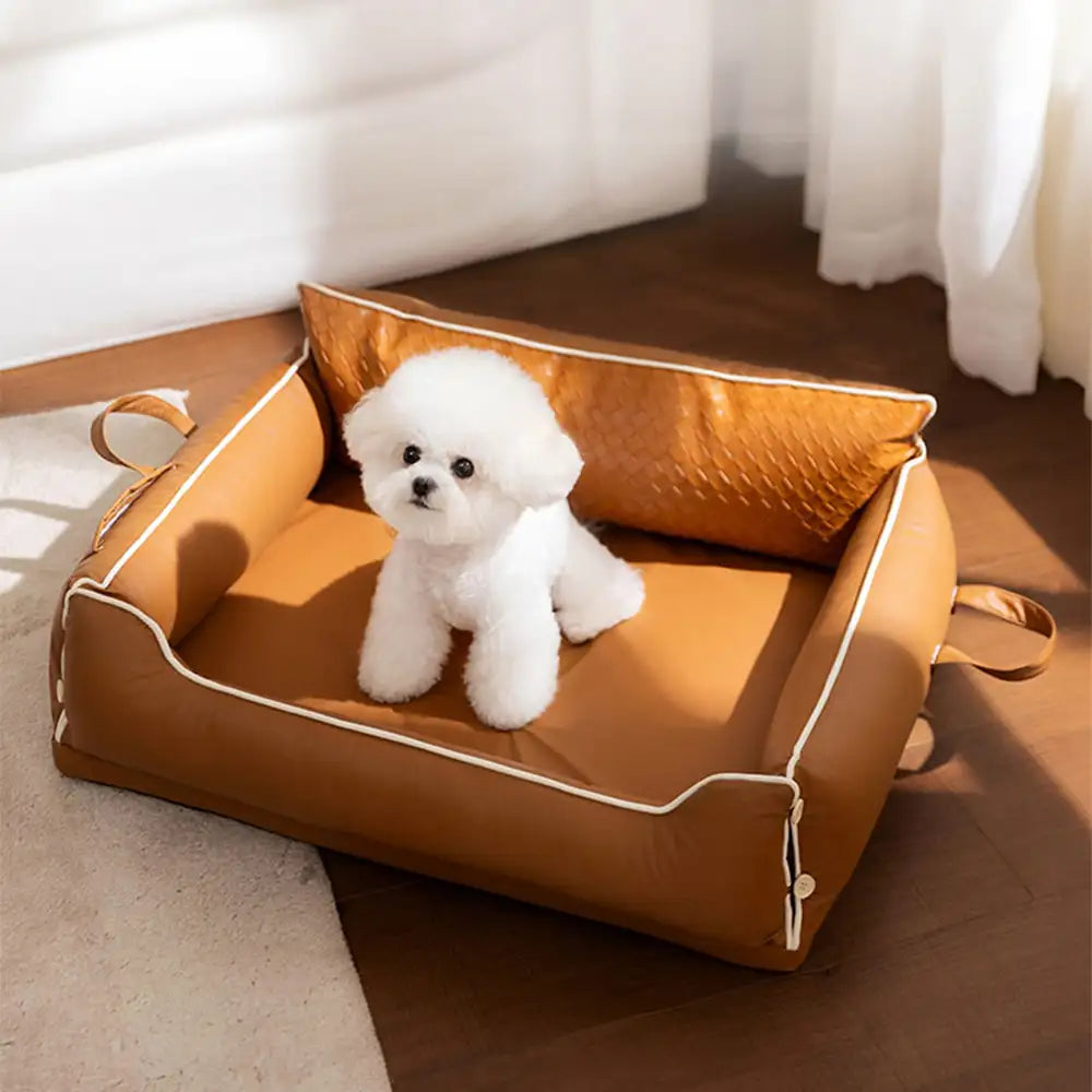 Letto per cani in pelle sintetica impermeabile con schienale protettivo in lattice
