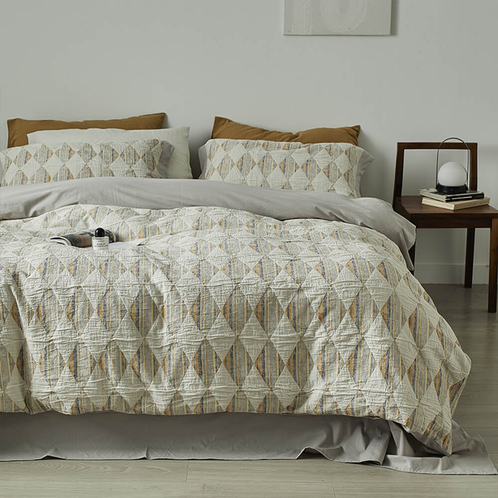 Set di lenzuola in cotone plissettato a doppio strato con jacquard a diamante