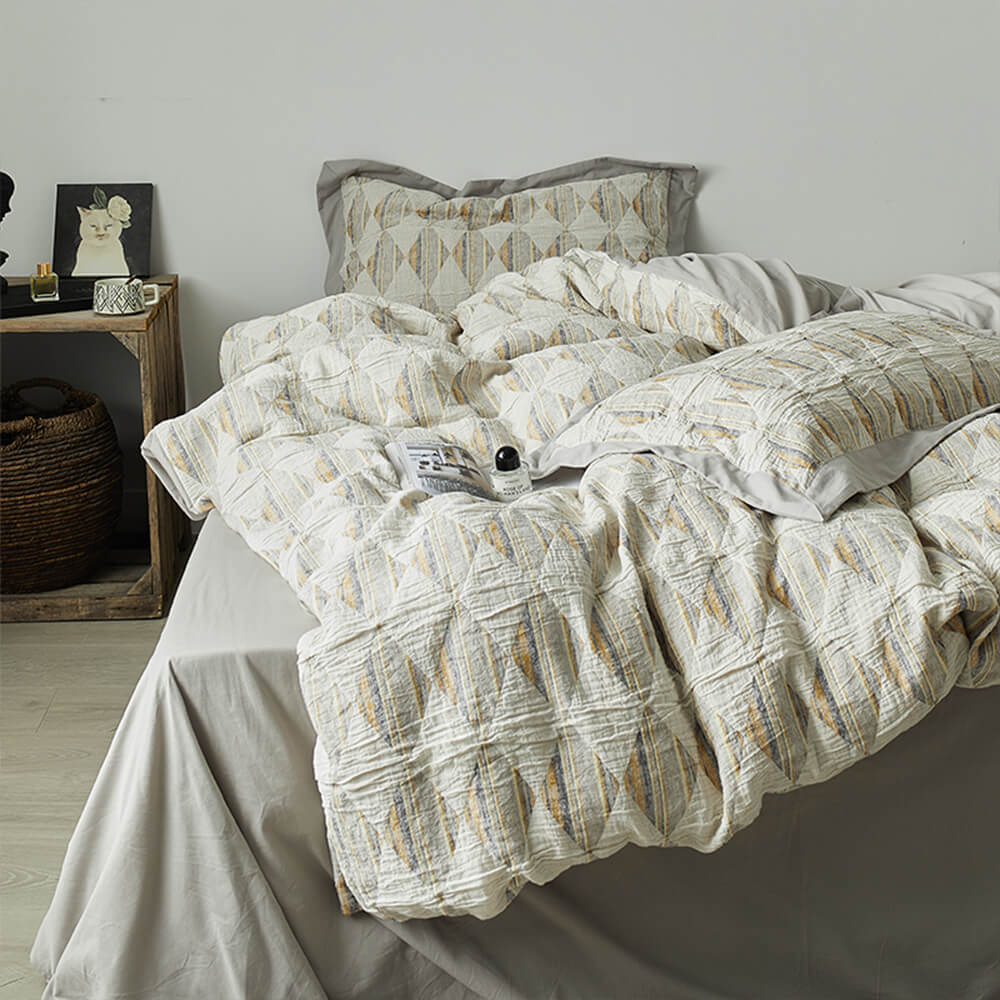 Set di lenzuola in cotone plissettato a doppio strato con jacquard a diamante
