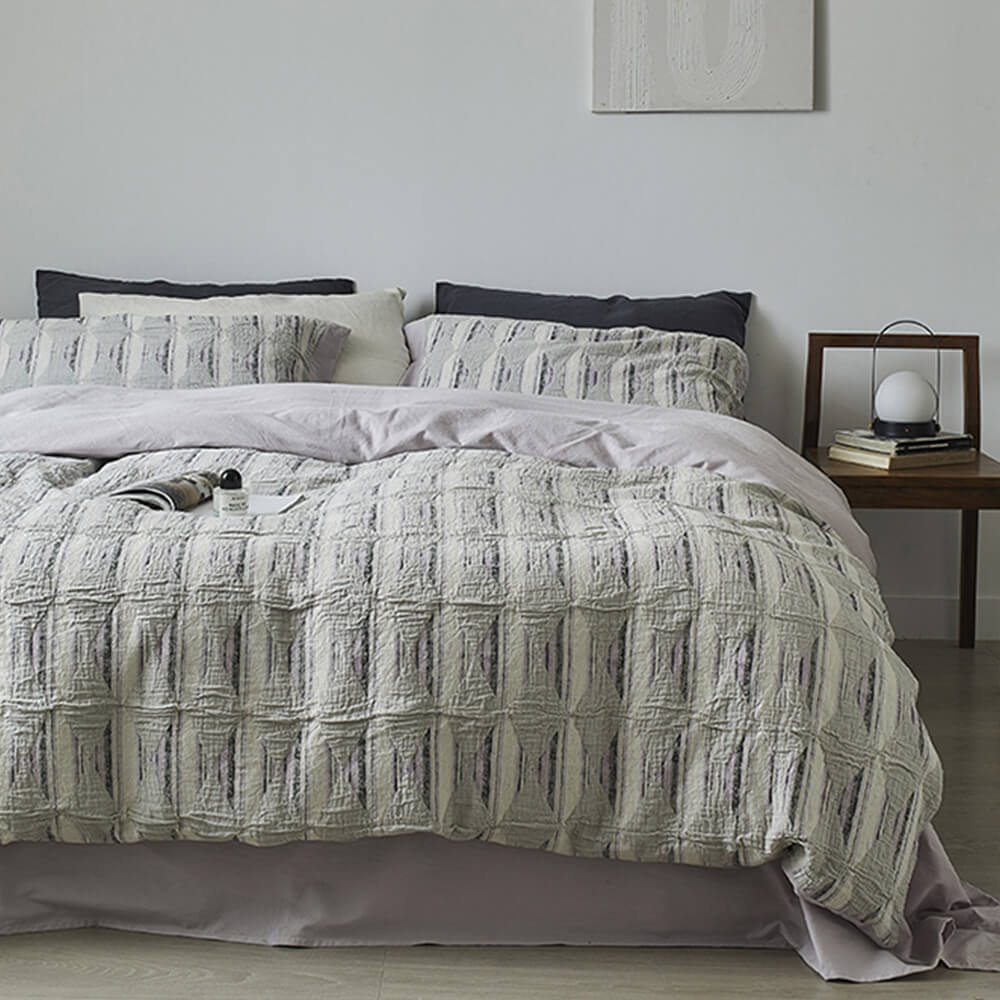 Set di lenzuola in cotone plissettato a doppio strato con jacquard a diamante