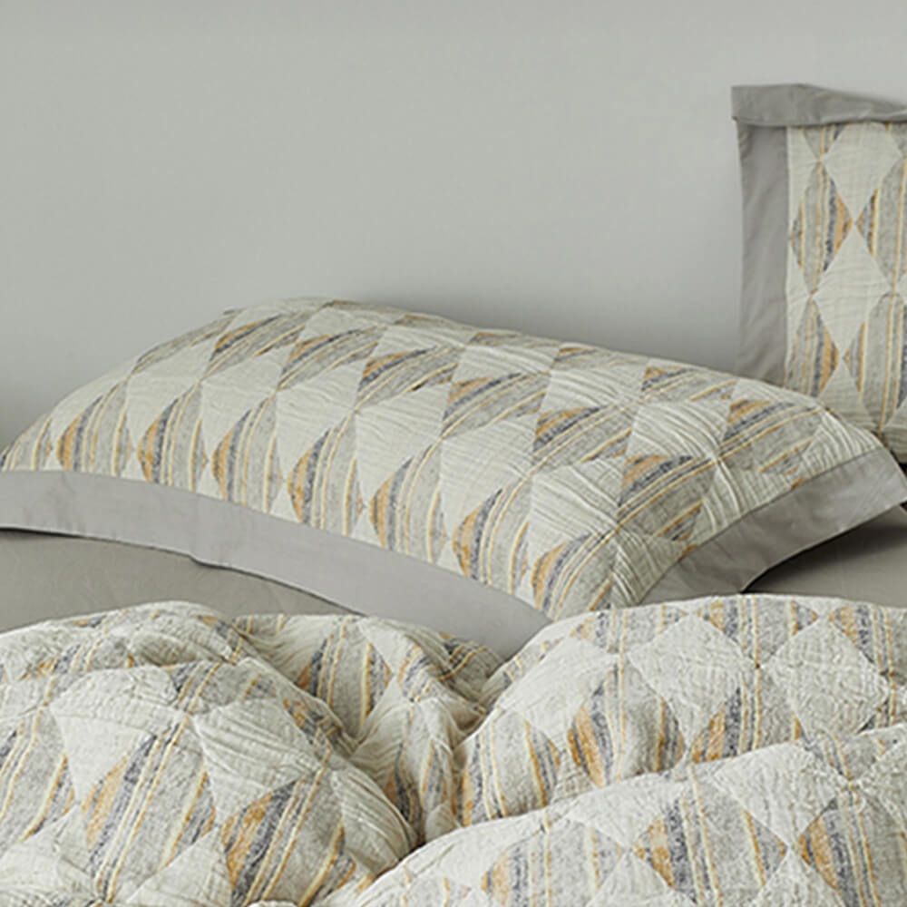 Set di lenzuola in cotone plissettato a doppio strato con jacquard a diamante