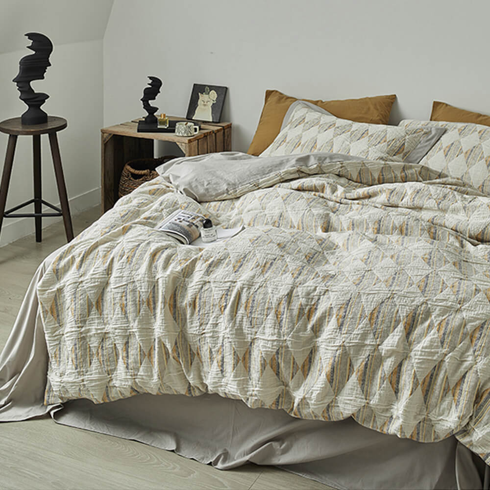 Set di lenzuola in cotone plissettato a doppio strato con jacquard a diamante