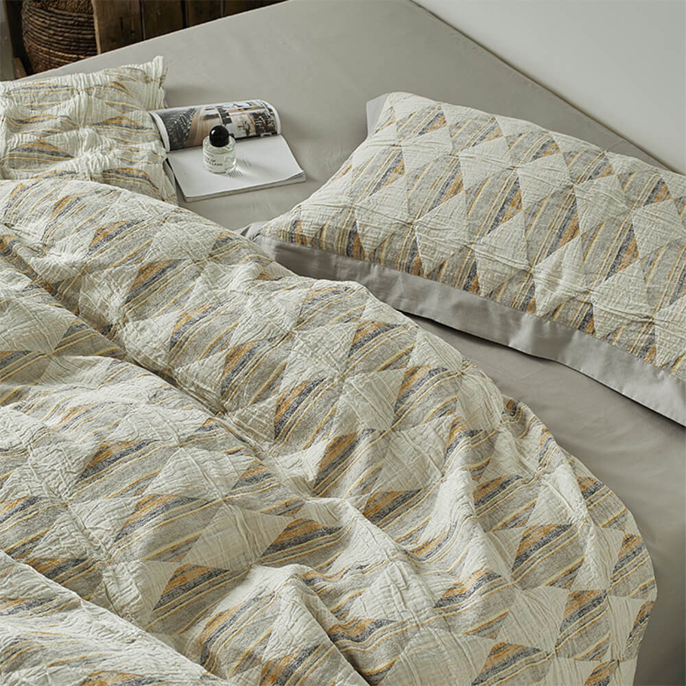 Set di lenzuola in cotone plissettato a doppio strato con jacquard a diamante