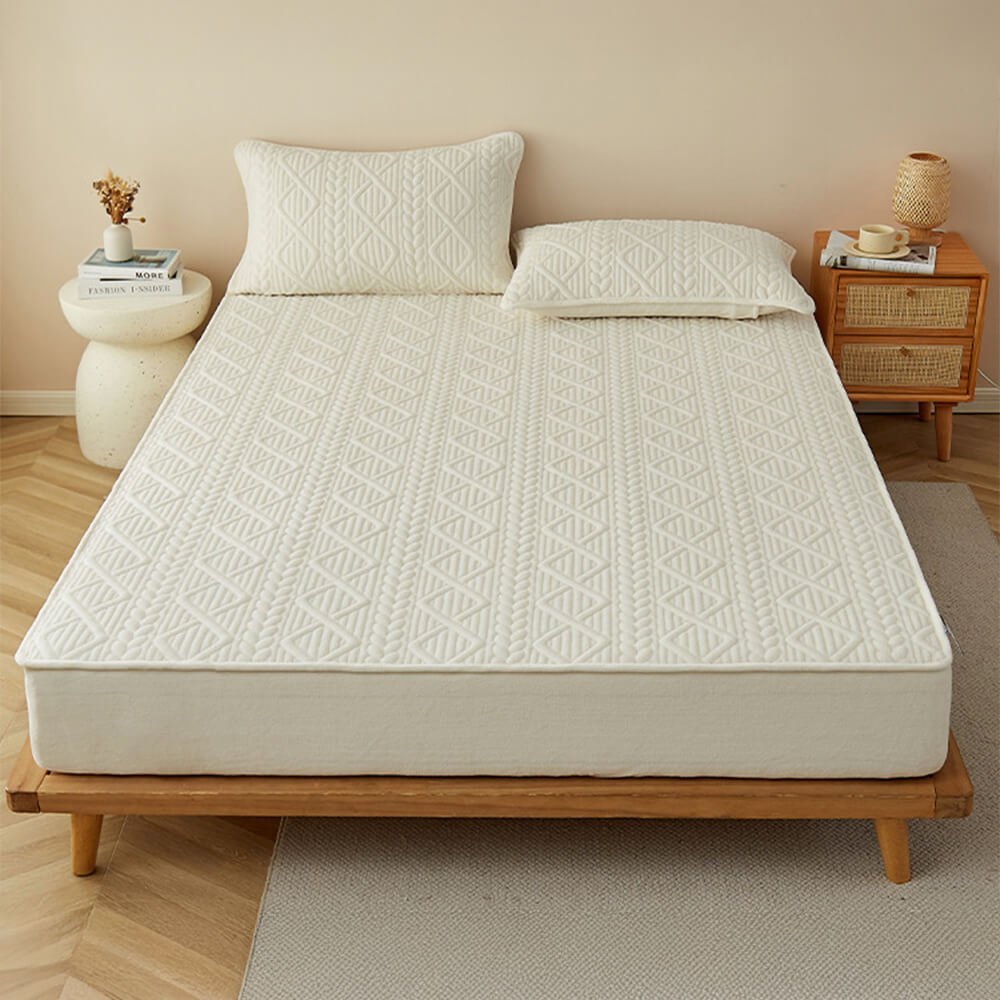 Copertura per materasso in velluto di latte trapuntata con imbottitura geometrica ispirata al grano.