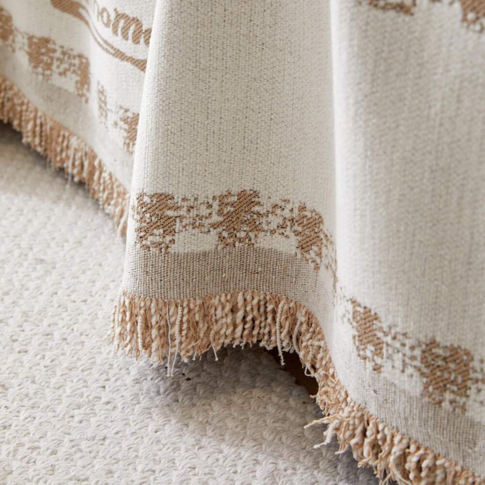 Copertura per divano in chenille con motivo retro a quadretti, con frange decorative.