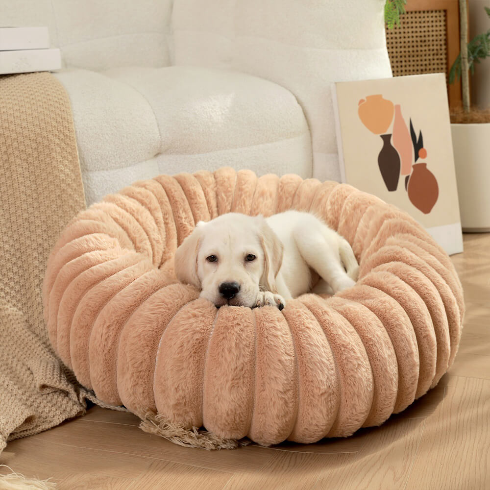 Letto per cani e gatti a forma di ciambella ultra-morbido in peluche.
