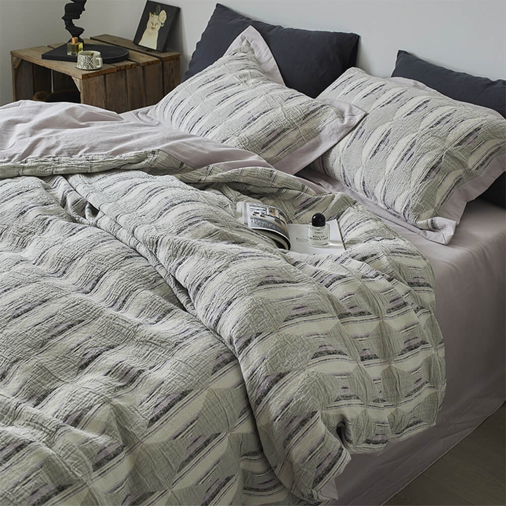 Set di lenzuola in cotone plissettato a doppio strato con jacquard a diamante