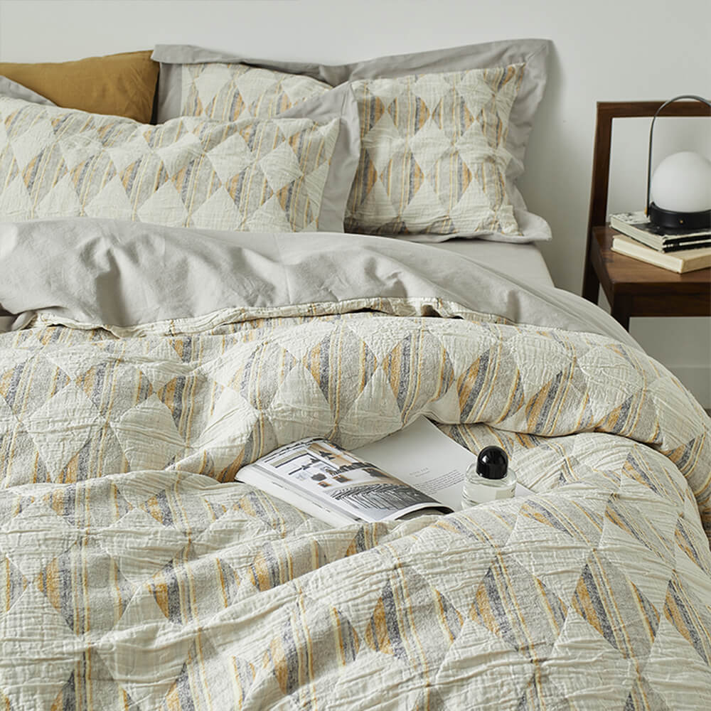 Set di lenzuola in cotone plissettato a doppio strato con jacquard a diamante