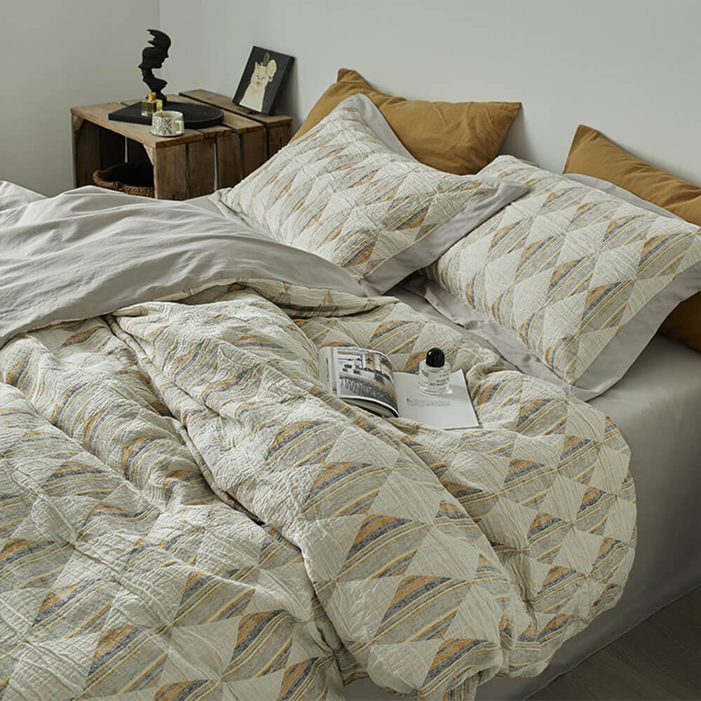 Set di lenzuola in cotone plissettato a doppio strato con jacquard a diamante