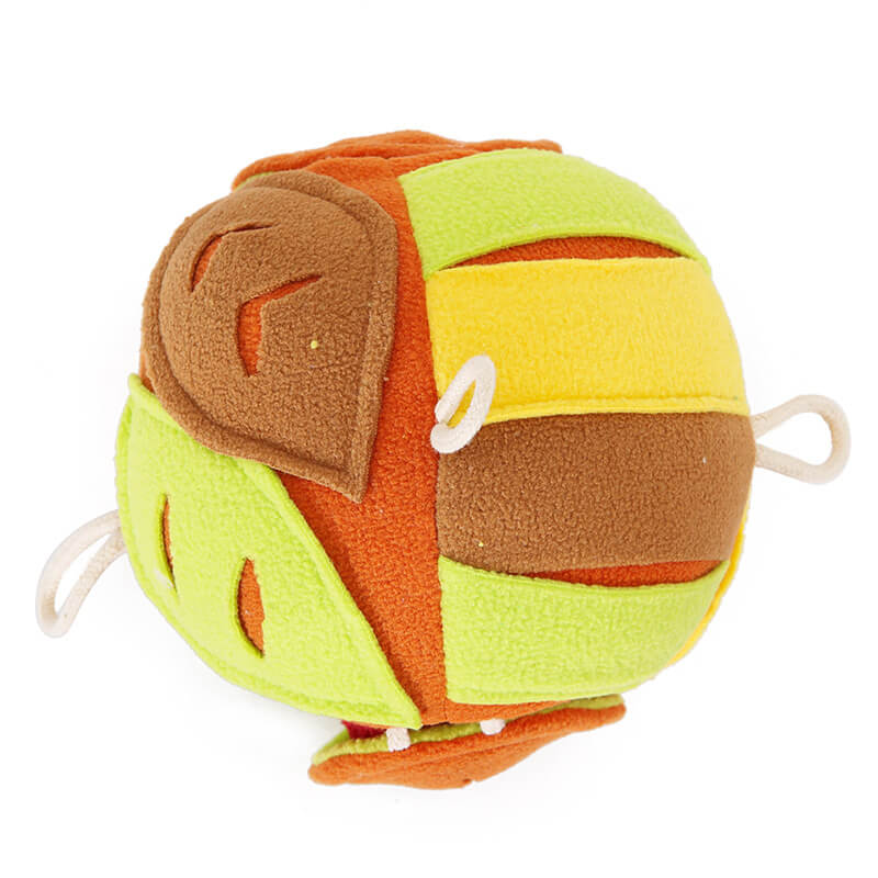 Gioco interattivo a forma di palla a foglia per cani con distribuitore di leccornie e suono sibilante.